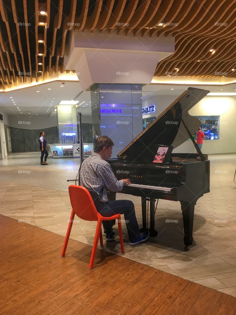 A random guy playing tunes in the mall