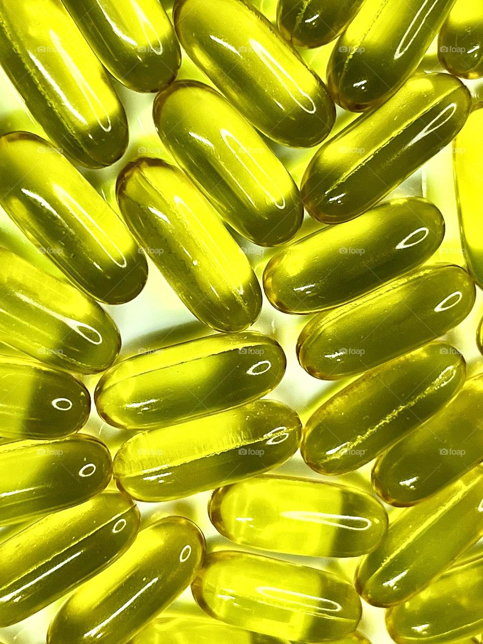 Transparent vitamin capsules shot close-up . Abstract . 