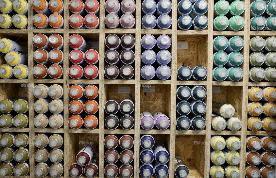 Colourful storage cubes for spray paint in lots of pretty colours 