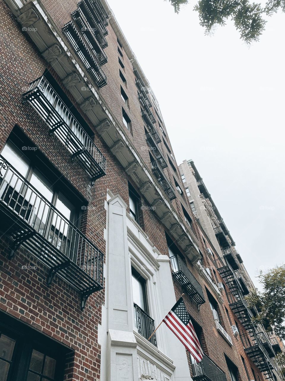 American Flag on the side of the apartment building. New York.