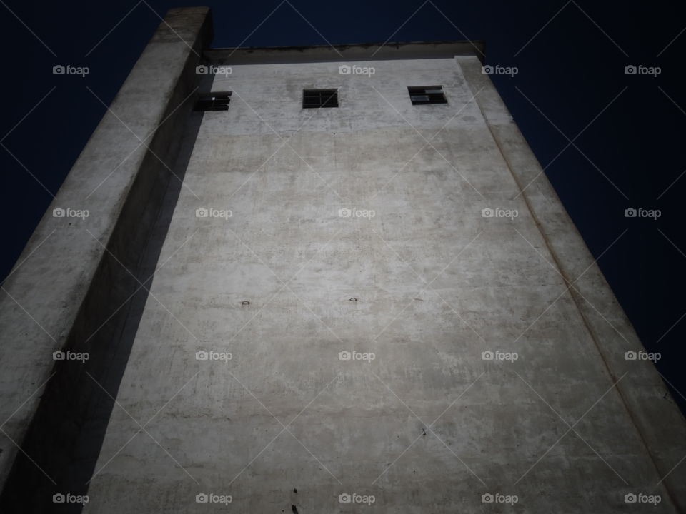 up up and away. This is a picture of a old grain elevator. 👣 🚶 🏃 🔥 💨