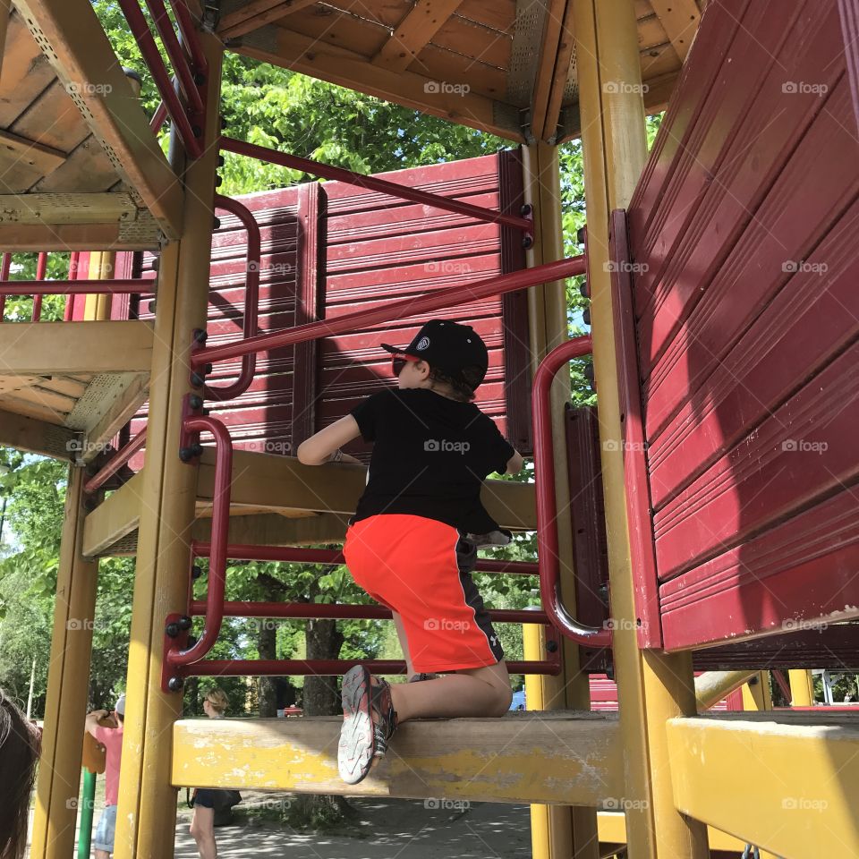 Boy having fun in a playground 