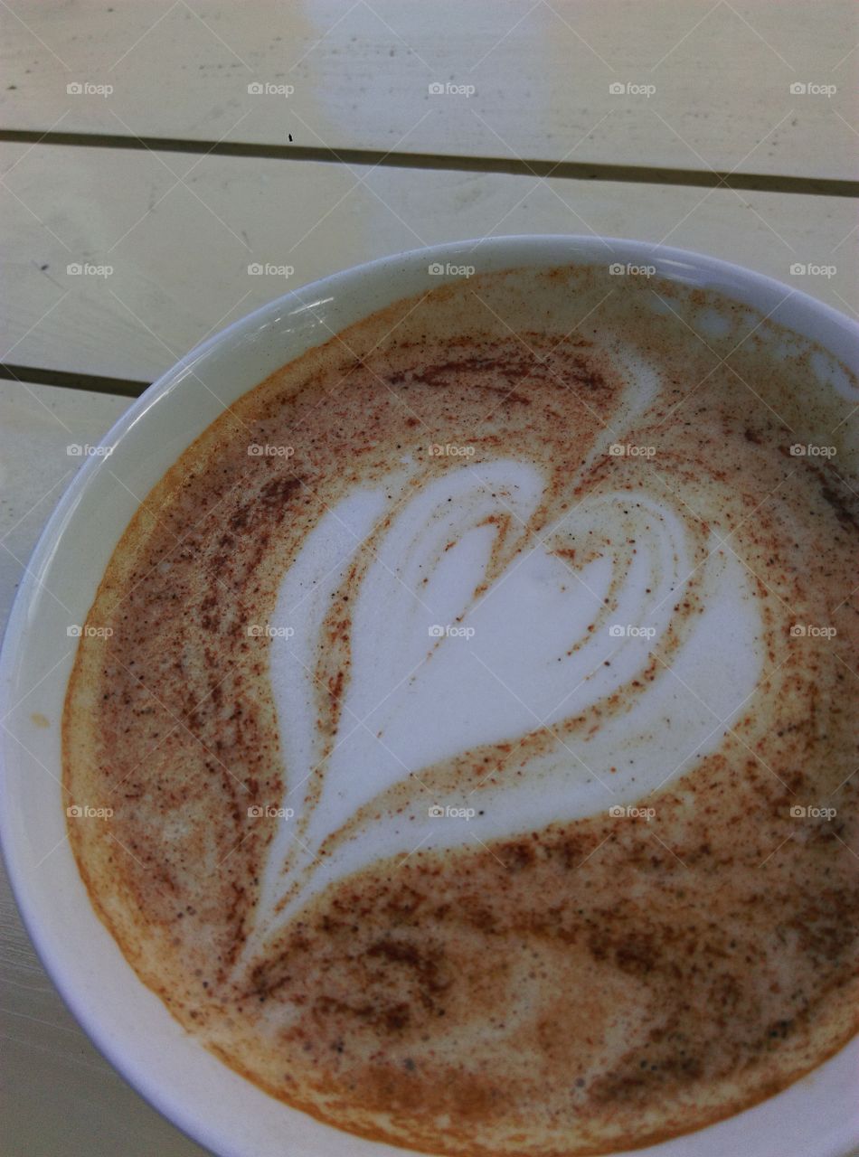 coffee love. Heart shape on cappuccino