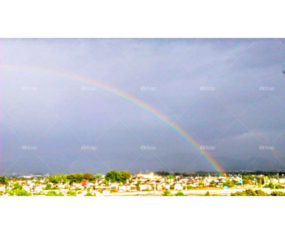 A rainbow after the rain above the plain, how beautiful and amazing!