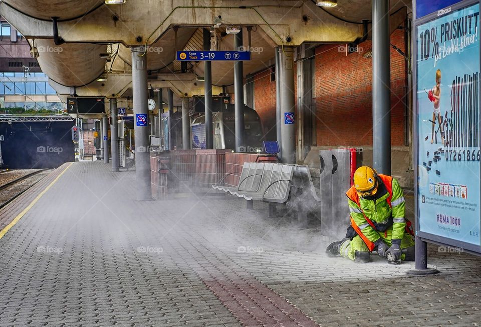 Man working on a train platform