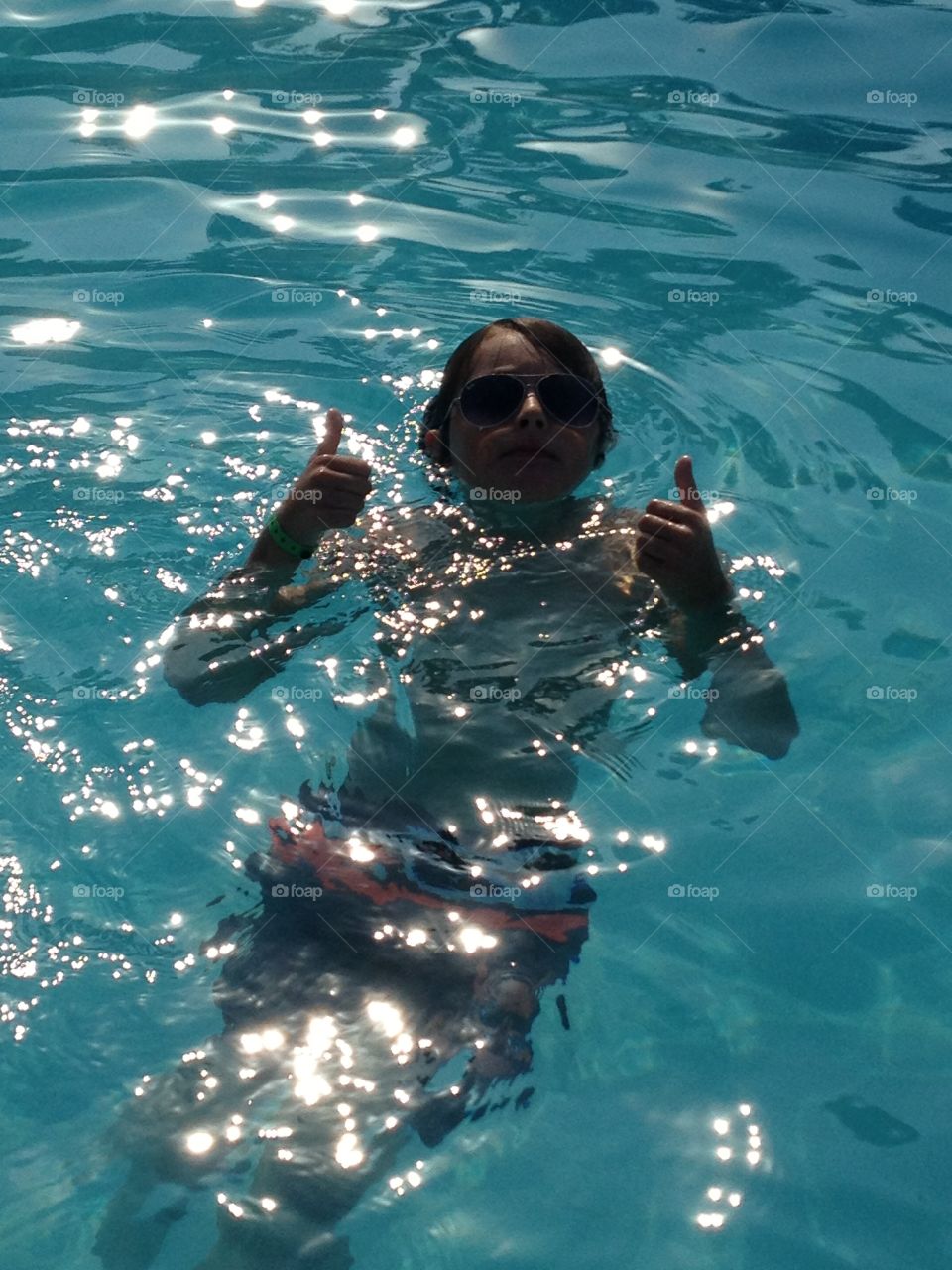 Chilling in the pool. A scorching hot day in sunny Cyprus. Sun on the water. Thumbs up! 
