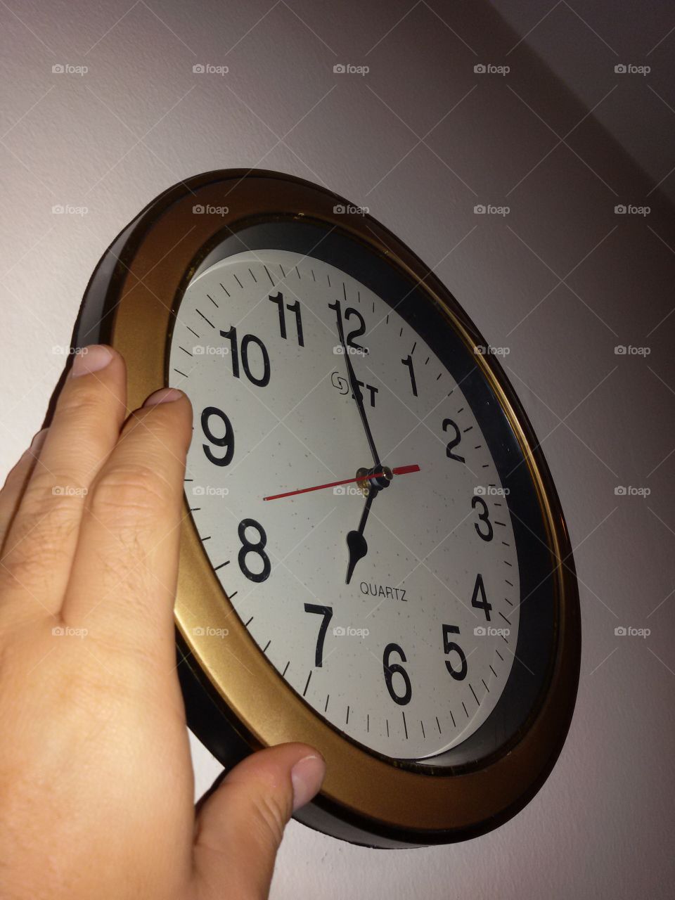 Gold clock on the wall