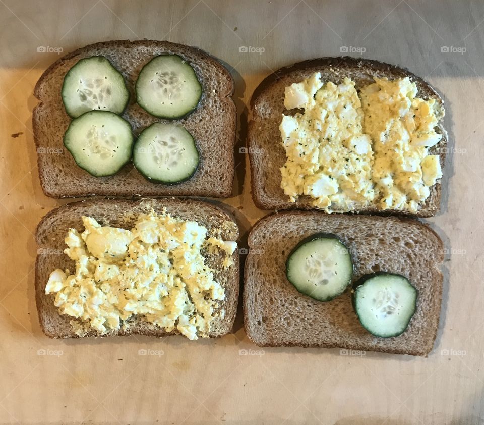 Open face egg salad sandwiches on wheat bread 