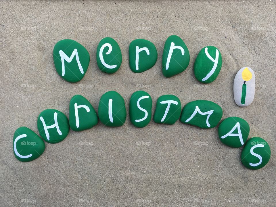 Merry Christmas with candles with green painted stones