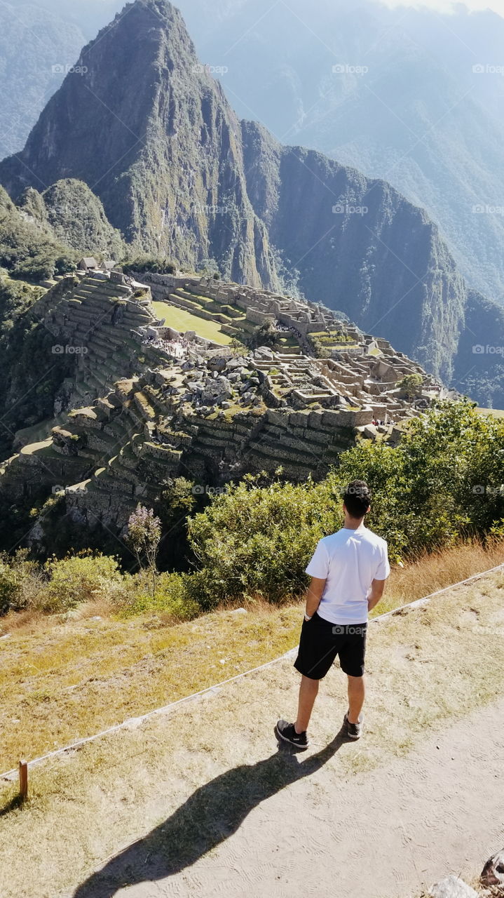 Looking past the deep valley over to these ancient ruins. This stunning view is seen by people from around the world but still not by enough. Everyone should have the opportunity to travel and see this wonder of the world. Help me to show this to Everyone!