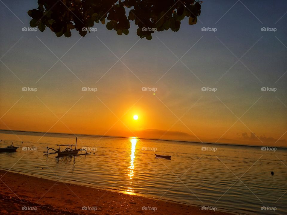 The wooden fishing boats and the beautiful sunrise view