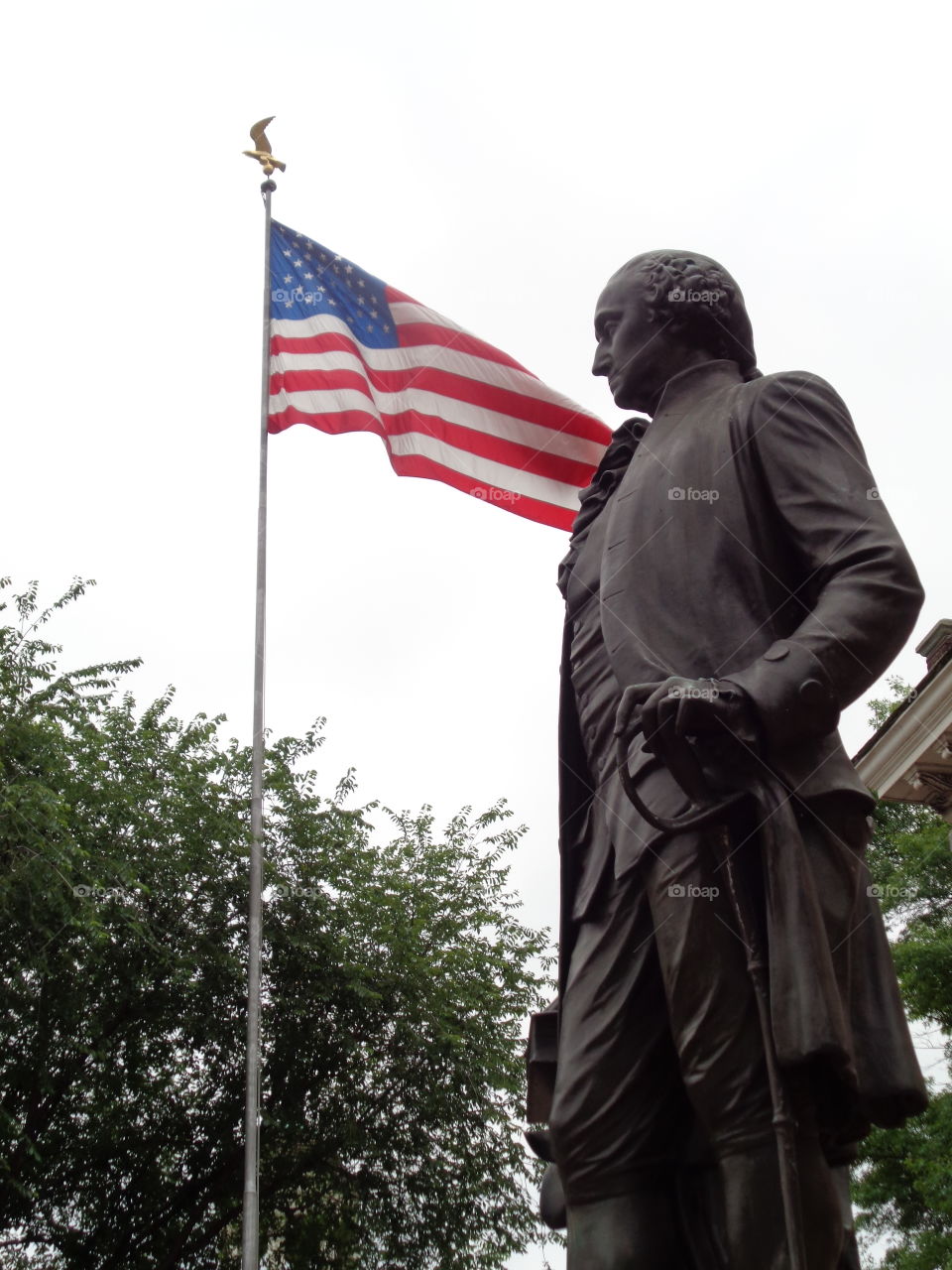 President Washington. Our first President proudly standing by our American flag.