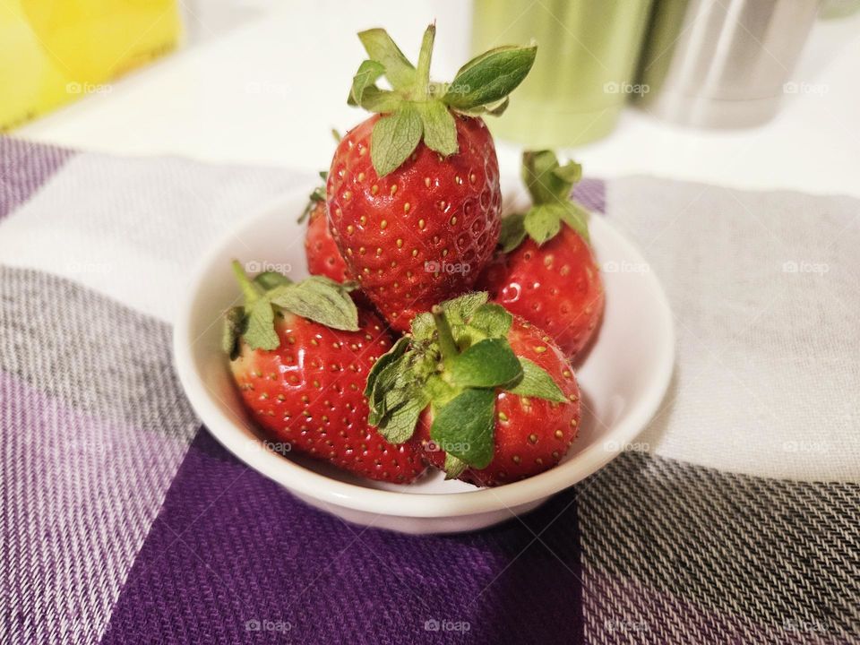 Strawberries and tablecloth