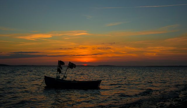 Silhouette of boat during sunset