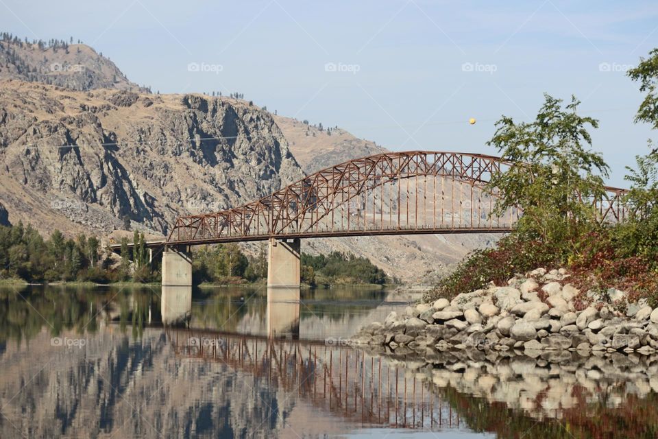 Bridge reflection in the still water