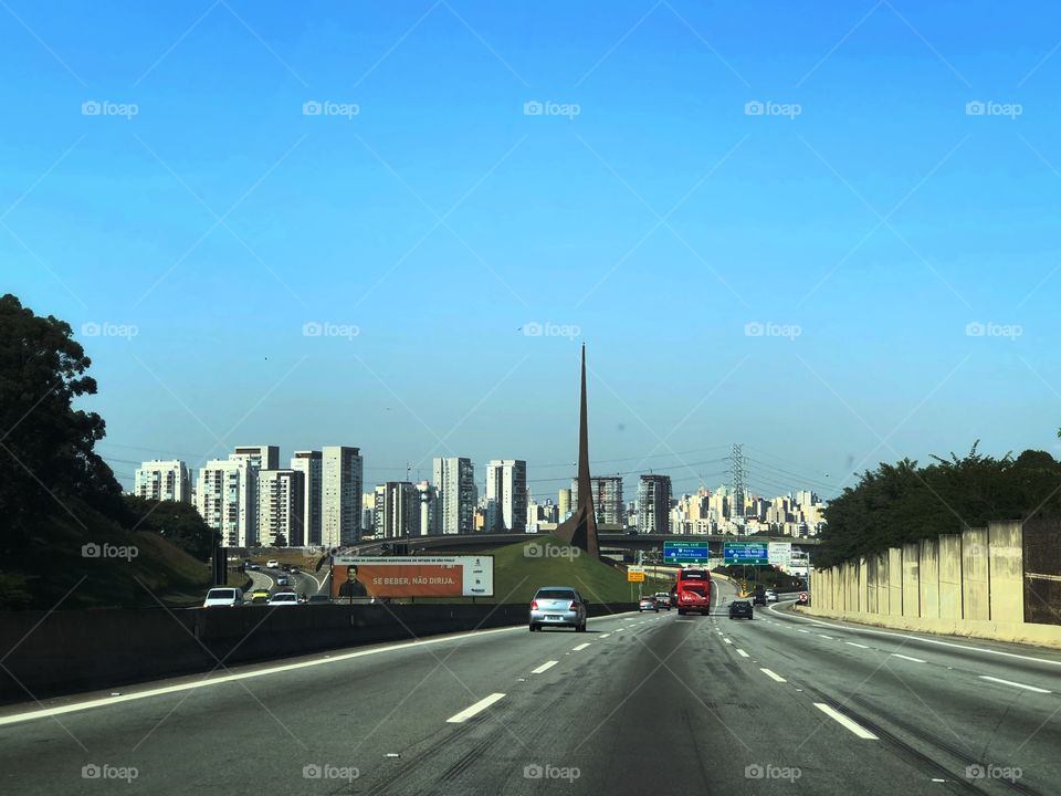 Arriving in São Paulo, through a highway coming from the country side. A beautiful view of the building of this big city. A rare moment without traffic to enter the city.