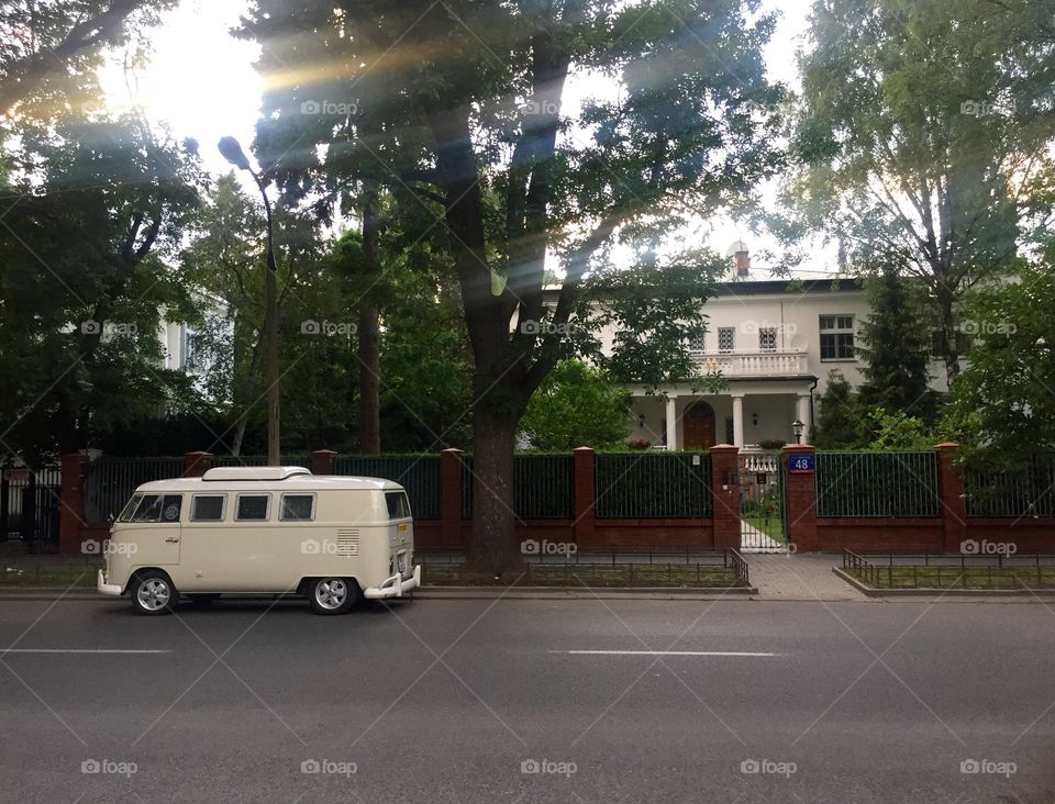 An old bus near a cottage