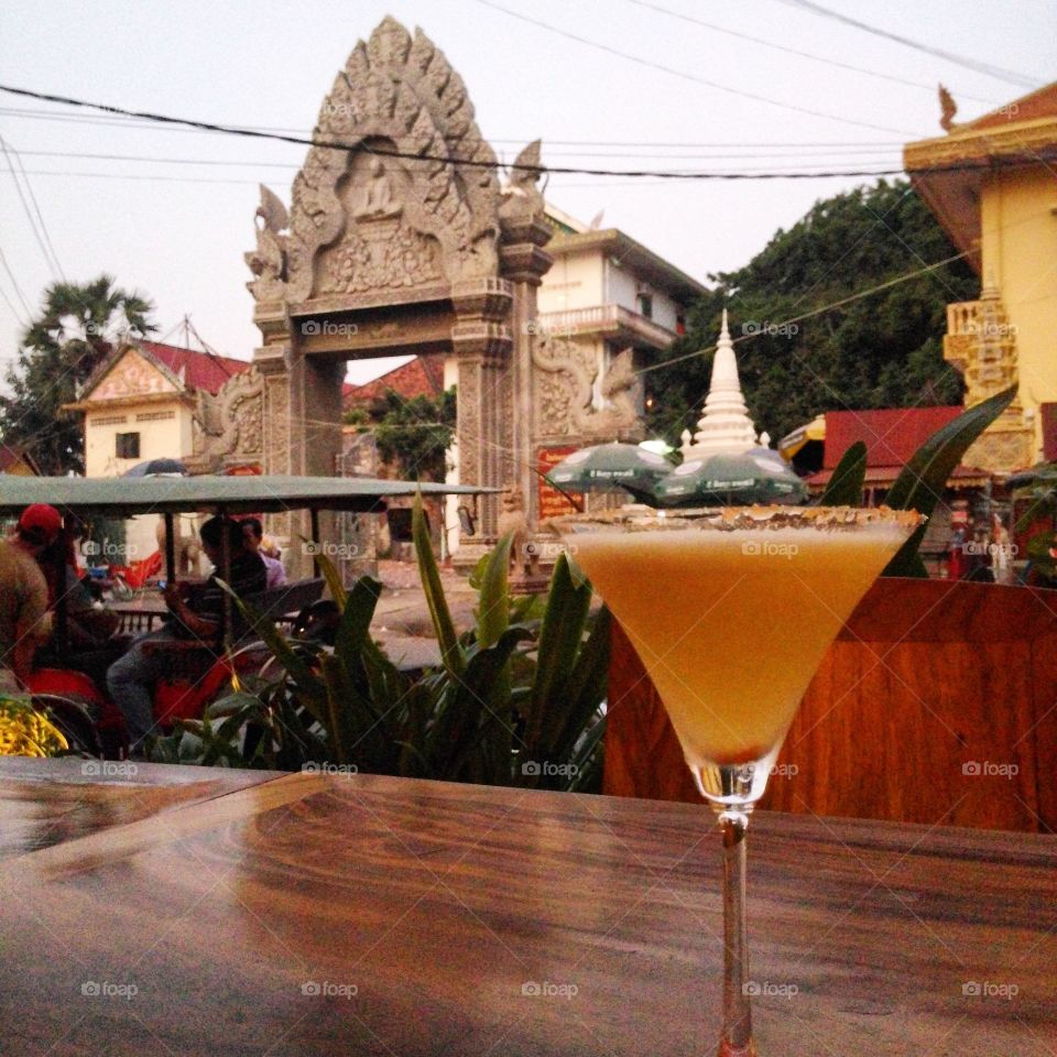 Happy hour. after a full long day of visiting temples,  a royal Palace,  the killing fields and S21 Genocide museum...   happy hour at 5$ was the best thing ever for these tired feet.  in Phnom Penh,  Cambodia  :) 
