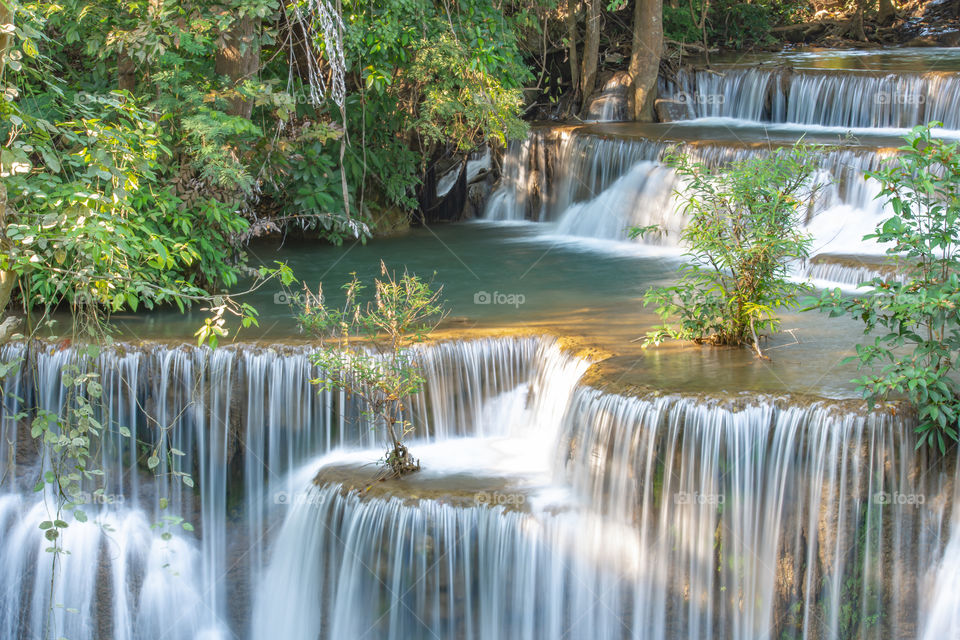 Waterfall flowing from the mountains at Huay Mae khamin waterfall National Park ,Kanchana buri in Thailand.