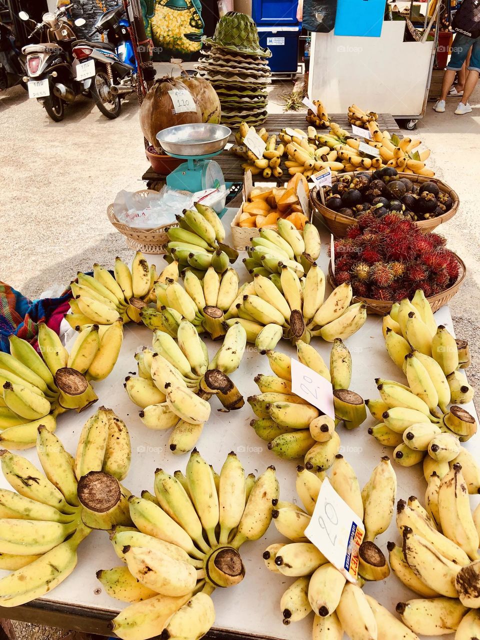 Bananas and other fruit displayed at a market stand in Bangkok, Thailand, organic fruit on sale 