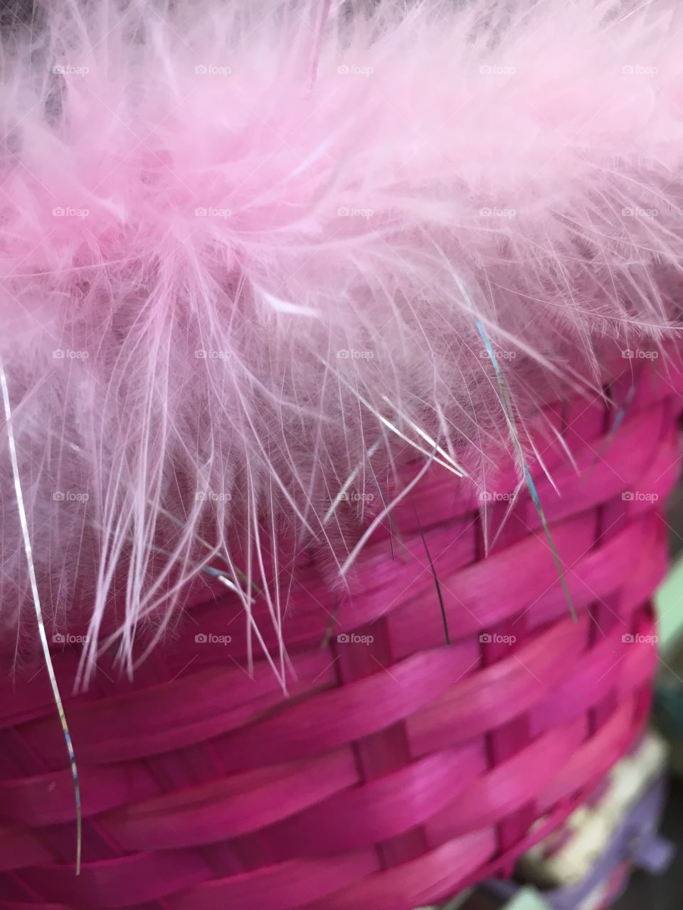 Pink easter basket with feathers