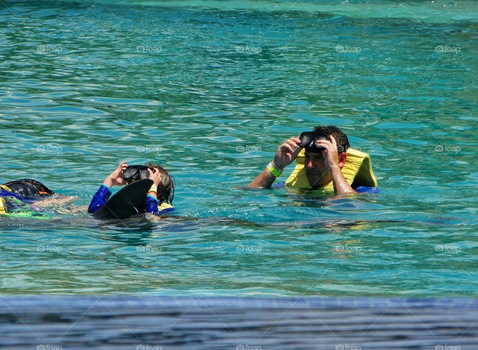 Father And Children Swimming
