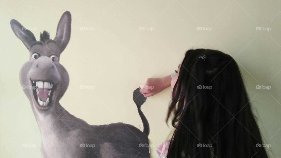 Small girl and a donkey