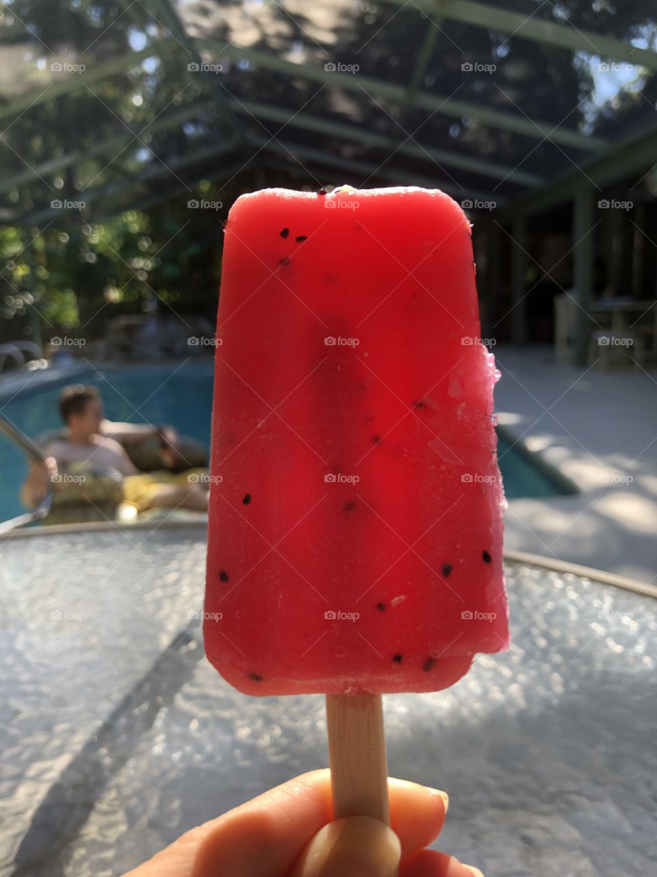 Strawberry popsicle by the pool.