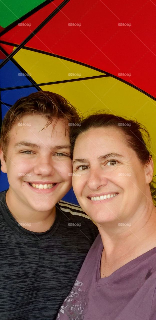 playing in the rain underneath our umbrella