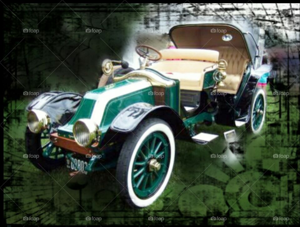 green classic cabrio car with white tyres