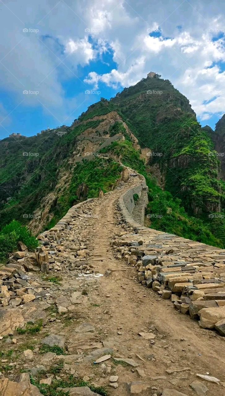 A stunning view of green mountains covered in fog in Yemen