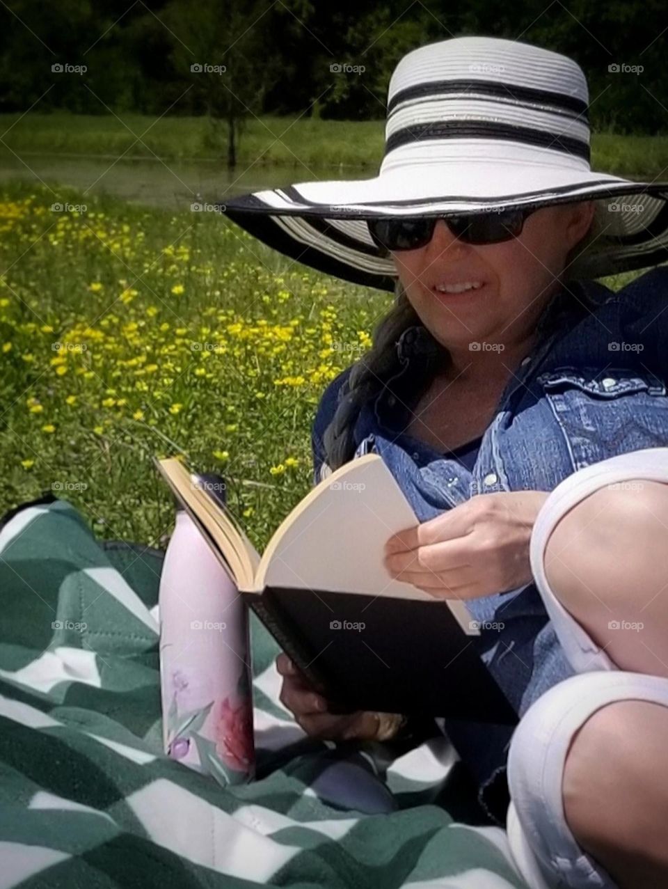 Thermos, big hat & a good book are must haves on vacation