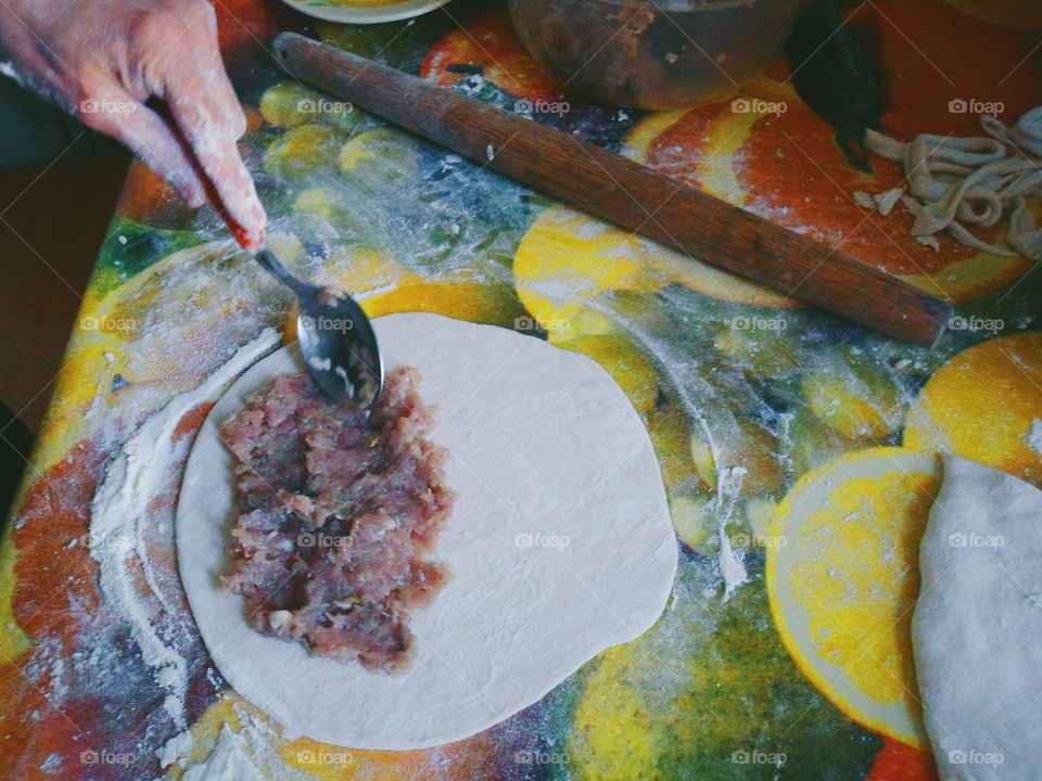 in the kitchen modeling of a delicious homemade cheburek with meat