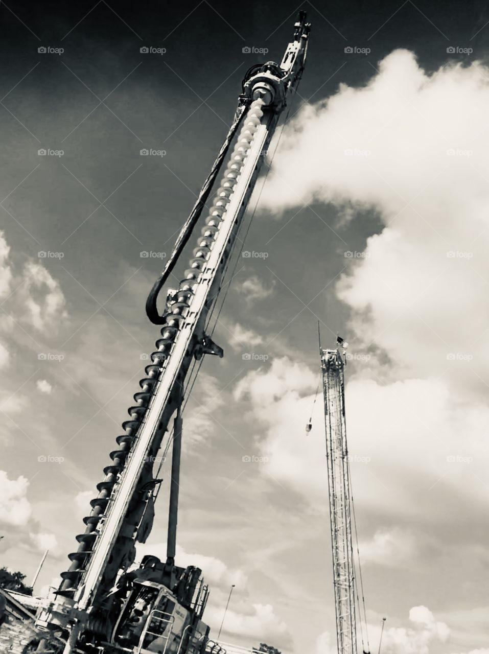 Giant drill for construction in black and white.