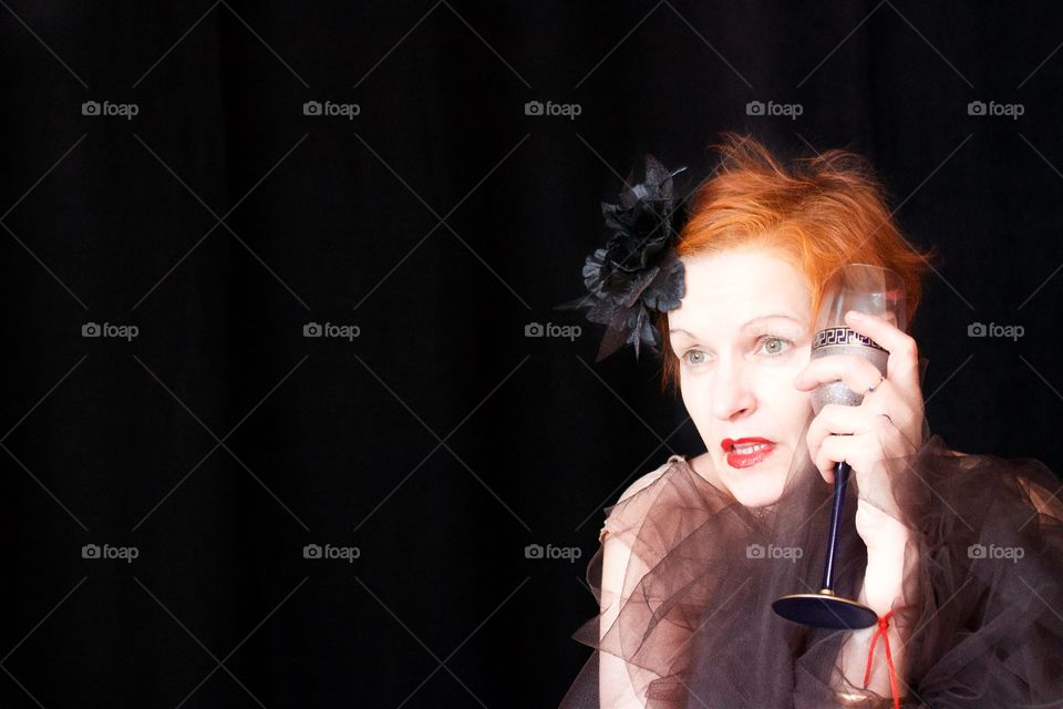 Ginger hair woman holding glass