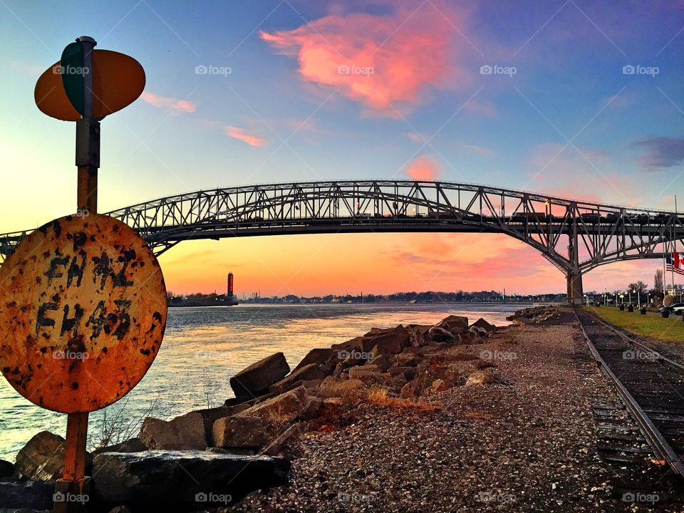 Metallic arch bridge over river