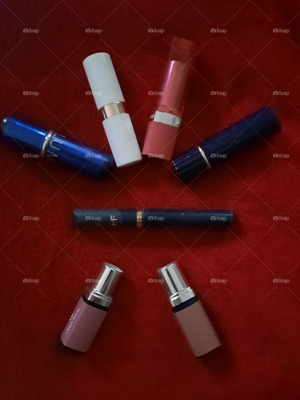 Make up products on red background