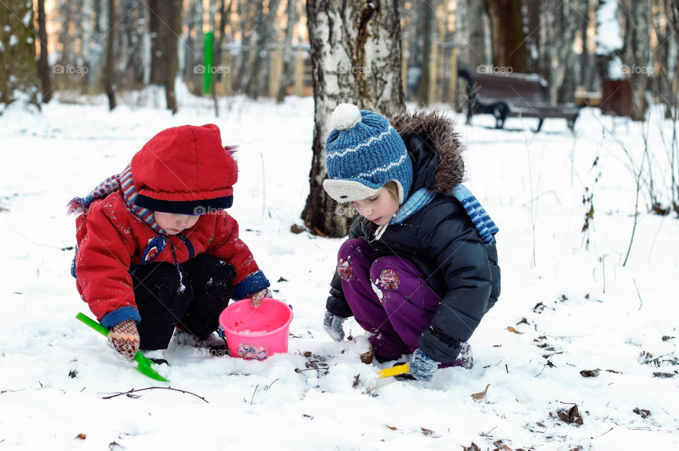 kids playing with snow