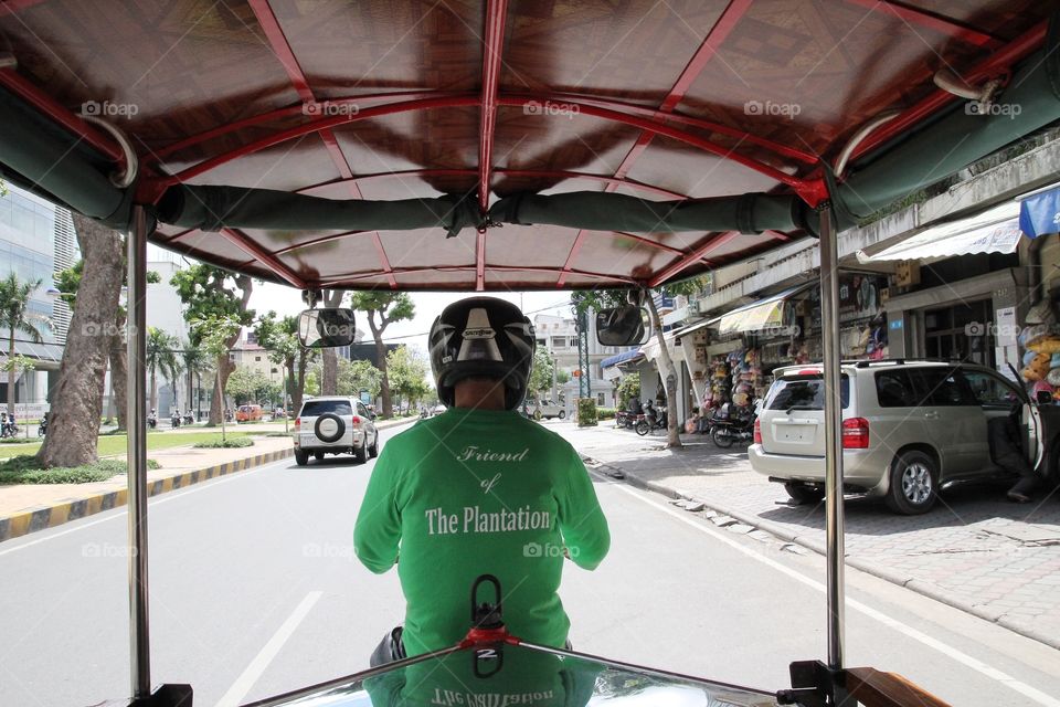 A  guy on tuk tuk