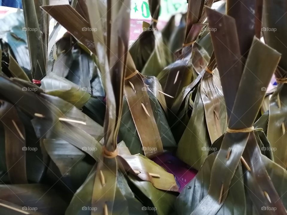 Plastic​ free​ Living​: Ready to bring​ home​ sweet​ snacks. Thai traditional​ food wrapped​ using​ banana​ fresh​ leaves. Grab now!