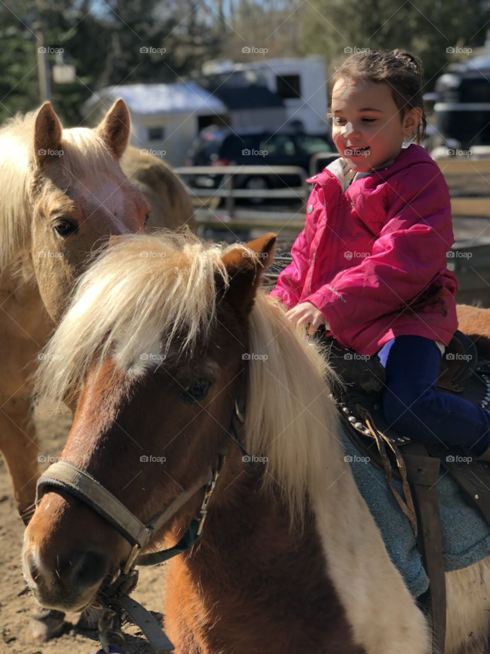 Riding her pony