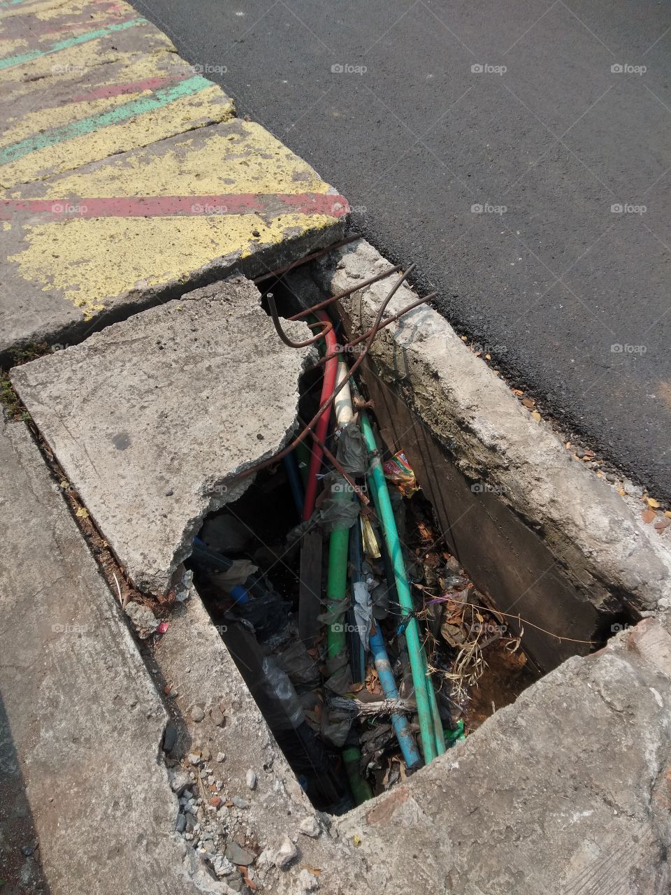 Almost a year through this road, there has been no improvement from the Depok city government regarding this perforated sidewalk. do you have to wait for someone to fall in the hole to fix it??