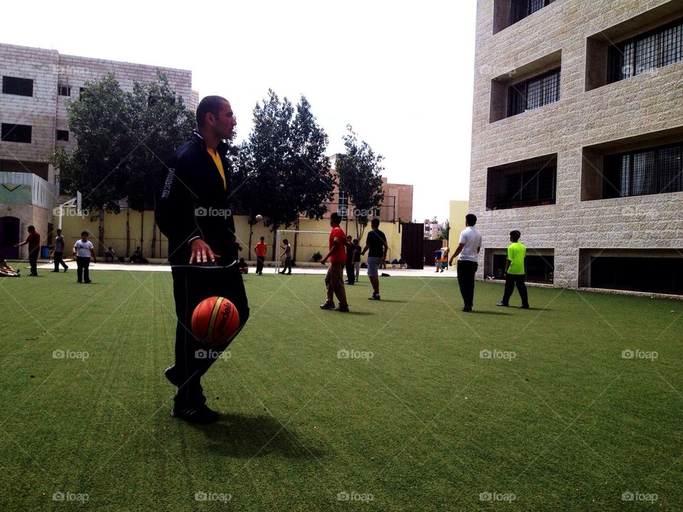 green play playing man by a.bilbaisi