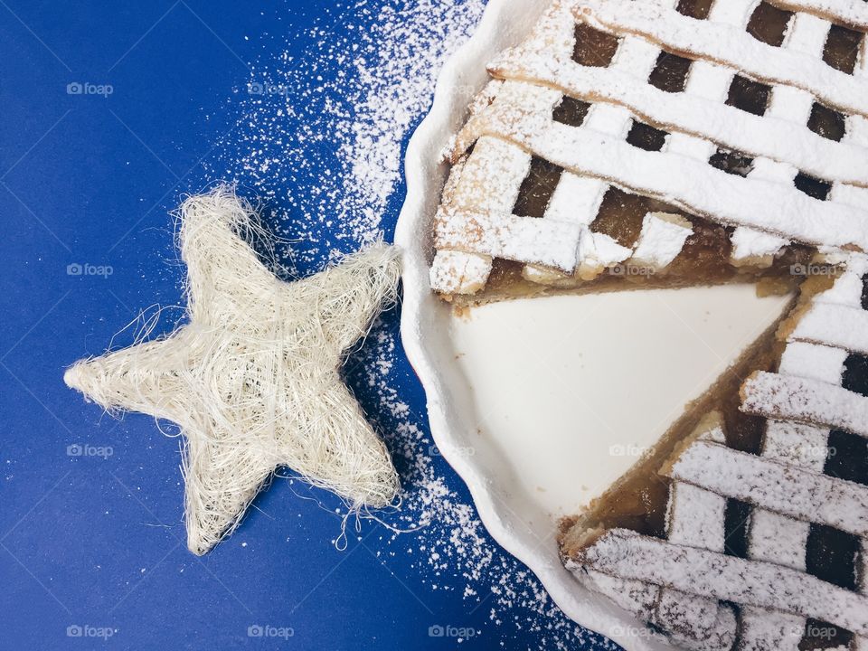 Close-up of cake preparing on blue background