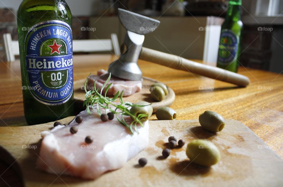 Cooking, drinking beer and watching football on tv