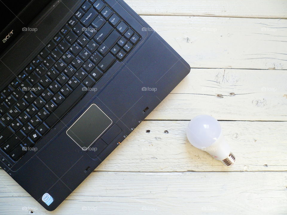 laptop, energy-saving light bulb