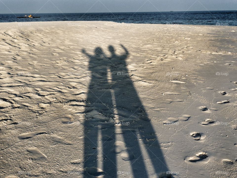 Shadow couple. Shadow pictures are so funny for those who take them as well as to look at it afterwards. This couple wants to say hello to all of you.