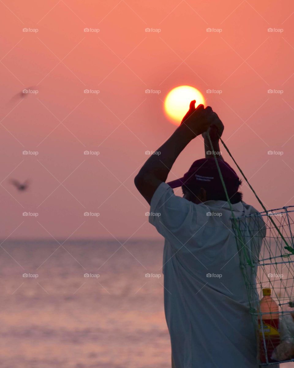 Vendor on the beach at sunset