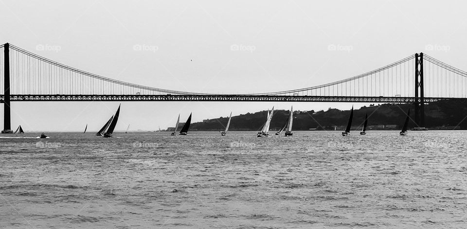 Black and white photography of yachts in lake 