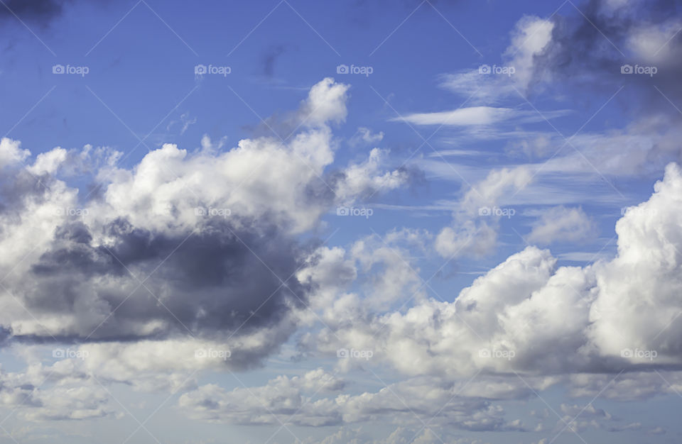 The beauty of the sky with clouds and the sun.